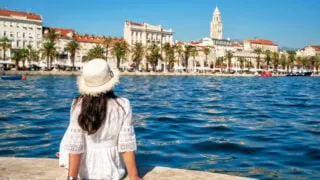Woman traveler travel to old town of Split in Dalmatia, Croatia. Split is the famous city and top tourism destination of Croatia and Europe