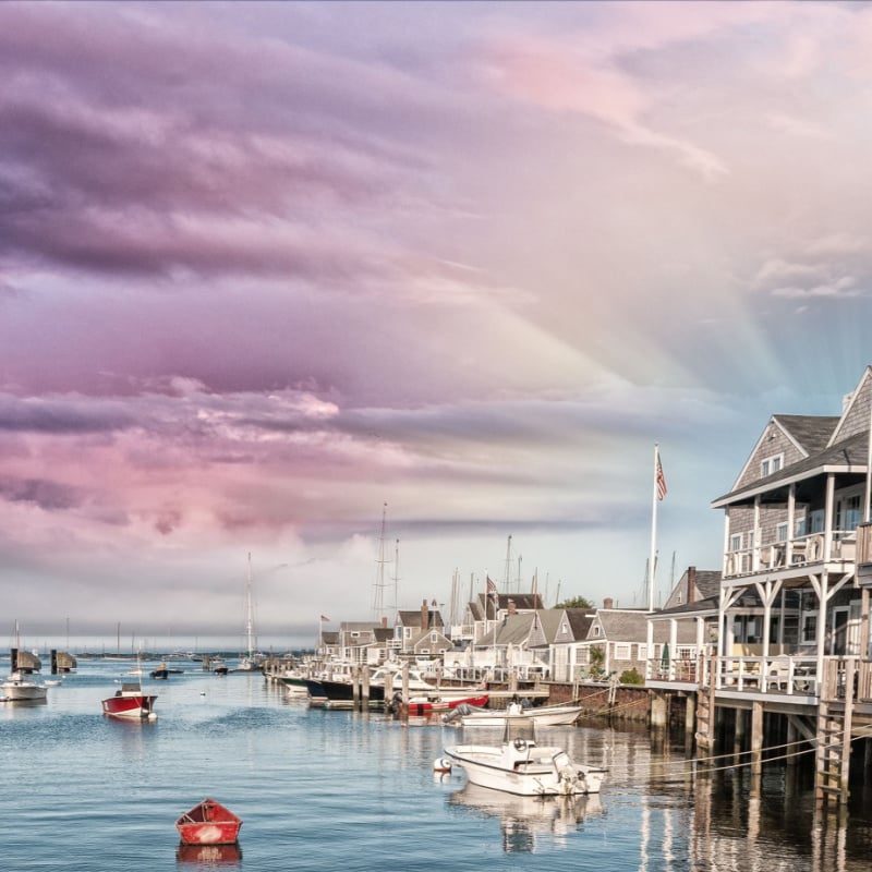 Beautiful homes of Nantucket, Massachusetts shown as dusk. 