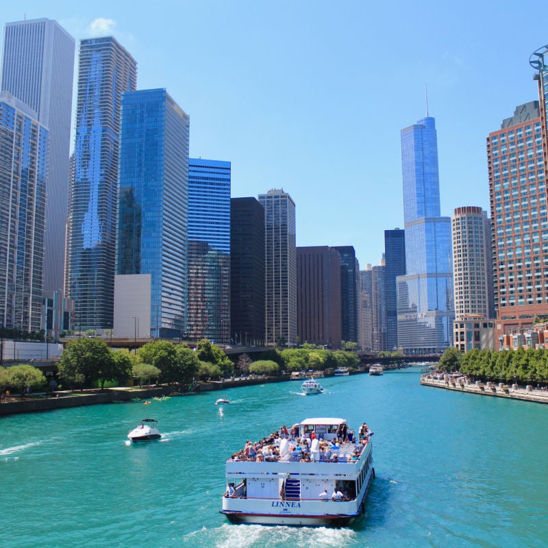 Chicago river view with tourists on boat
