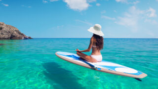 Woman paddle boarding in Hawaii
