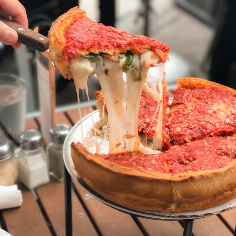 serving a slice of chicago style deep pan pizza