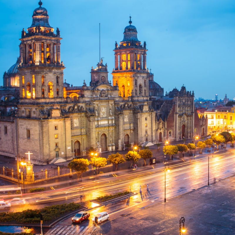 Metropolitan Cathedral and President's Palace in Zocalo, Center of Mexico City Mexico Sunrise night.