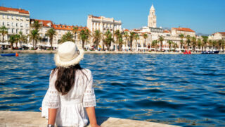 Woman traveler travel to old town of Split in Dalmatia, Croatia. Split is the famous city and top tourism destination of Croatia and Europe