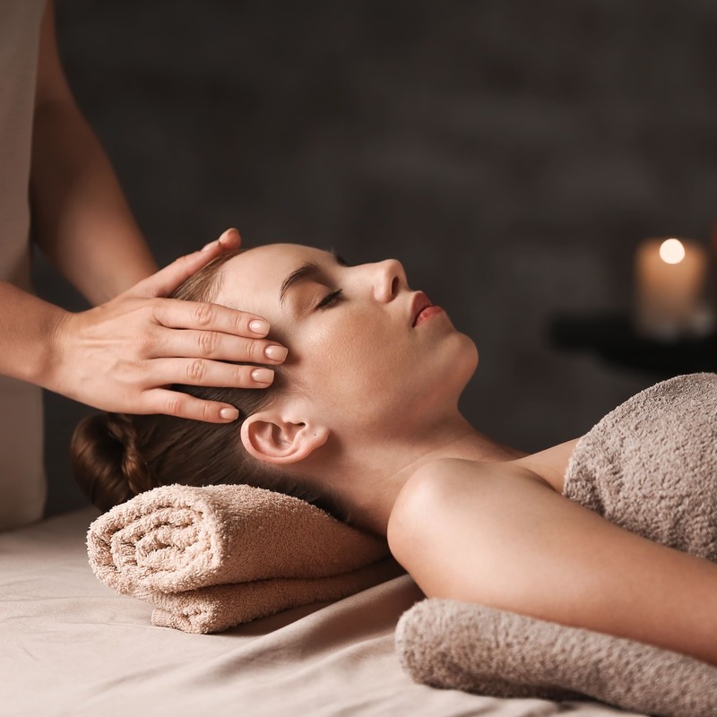 Young Woman Having A Head Massage At A Spa