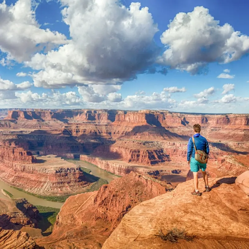 A hiker standing at the Grand Canyon