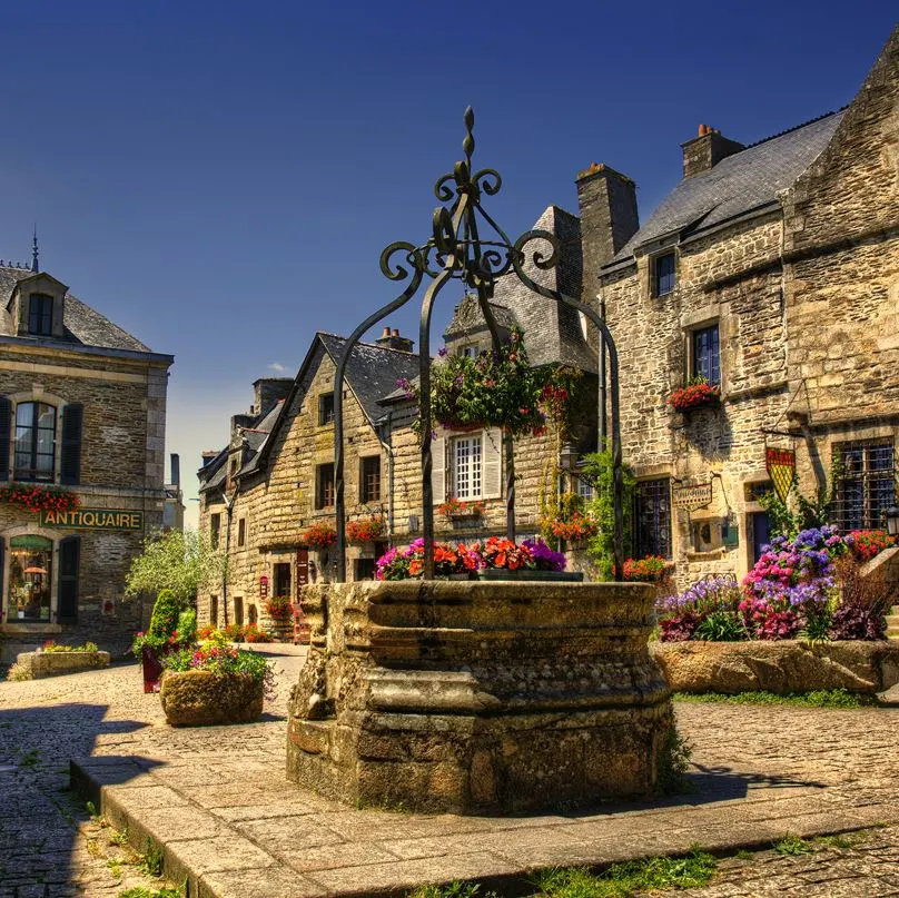 A traditional village with a well in Brittany, France. 