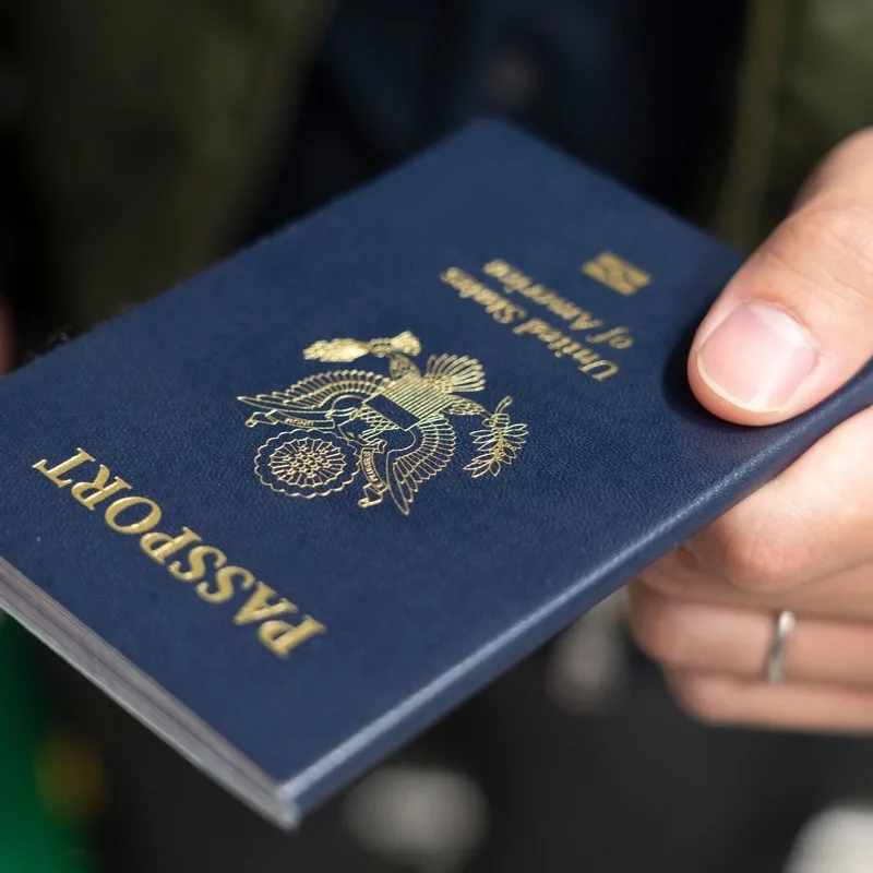 Close Up Of A Person Holding A U.S. American Passport