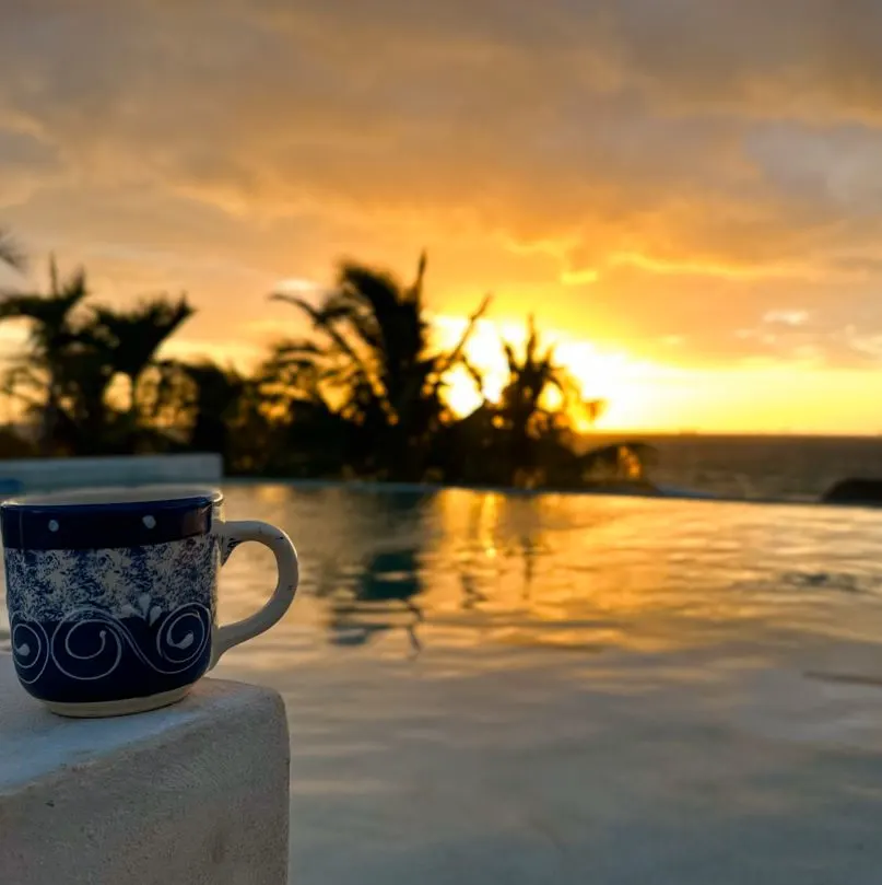 Coffee cup with the sunset in playa del carmen at vista hermosa, a maya luxe property