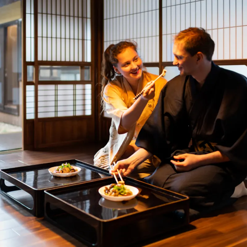 couple enjoy meal in a ryokan japanese traditional hotel