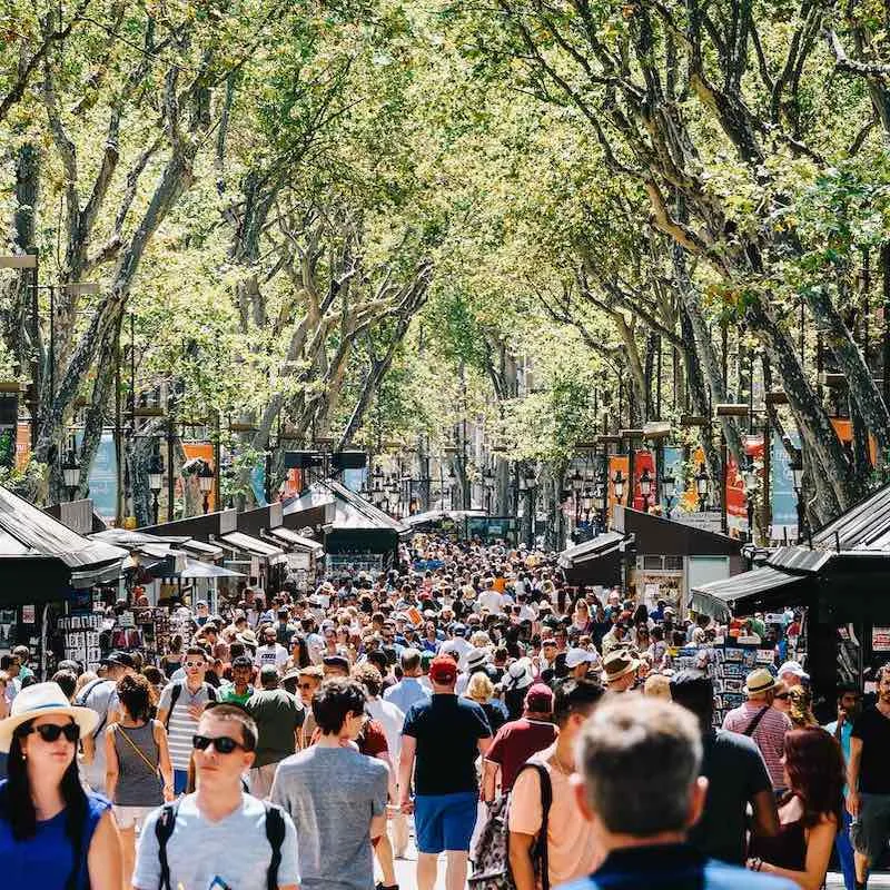 Crowd Of People In Central Barcelona City On La Rambla Street.