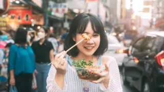 Woman eating street food