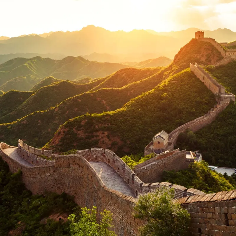 great wall of china and rolling green hills