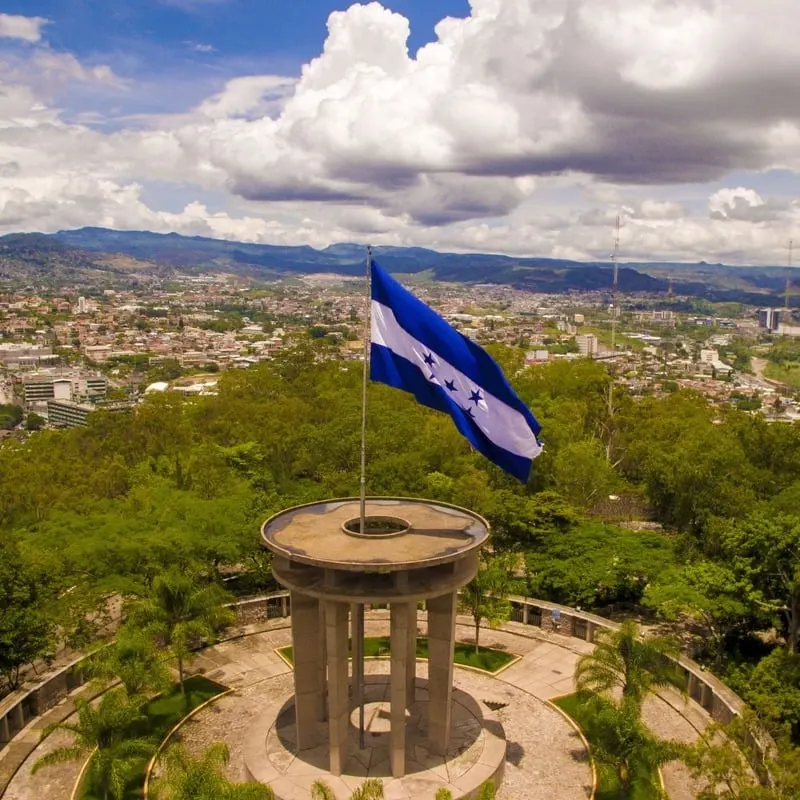 Honduran Flag Flying Over Tegucigalpa, The Capital City Of Honduras, Central America