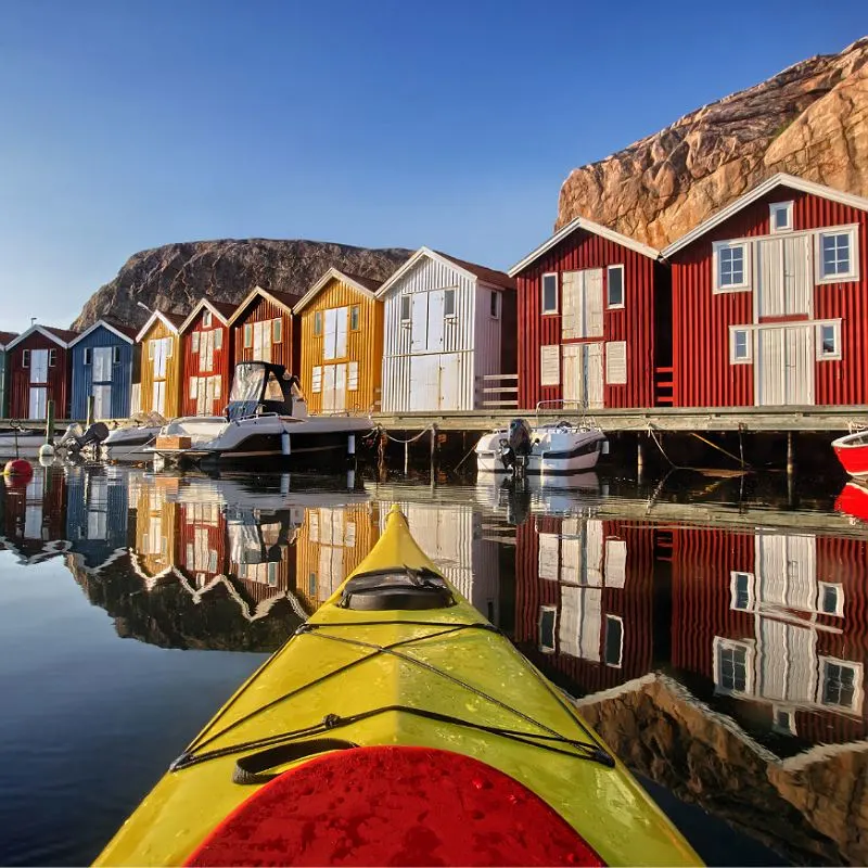 canoe in Sweden
 with colorful houses