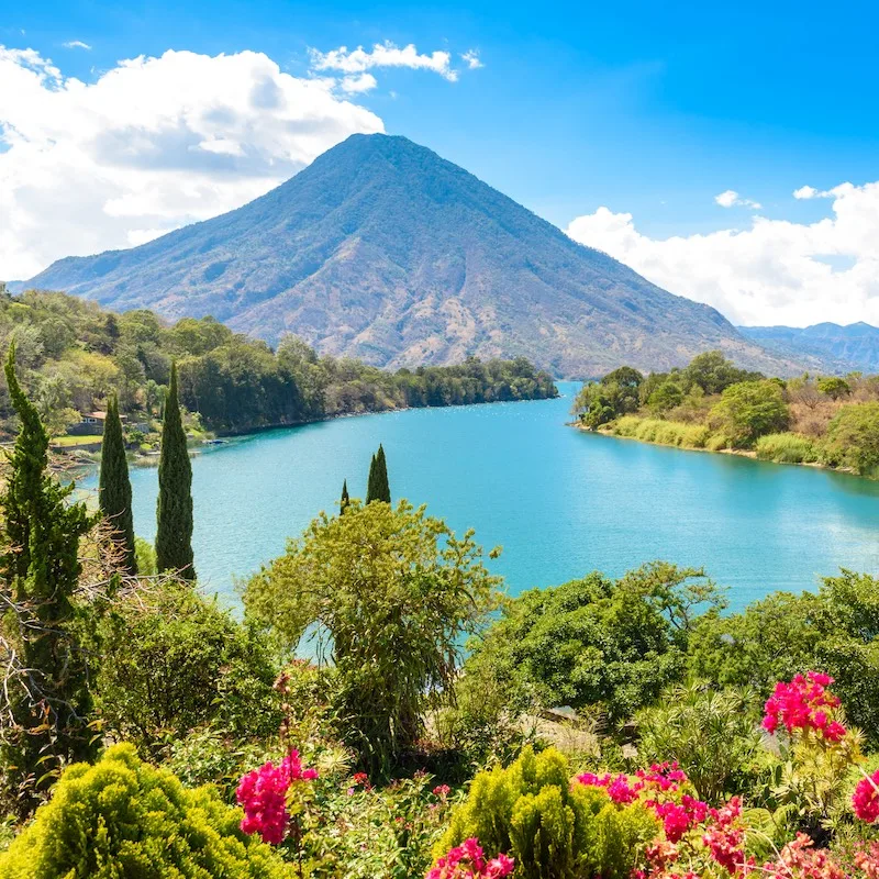 Beautiful bay of Lake Atitlan with view to Volcano San Pedro  in highlands of Guatemala, Central America