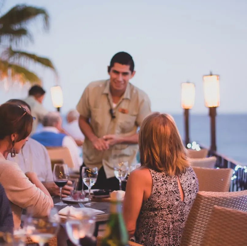 Los cabos restaurant with waiter and guests