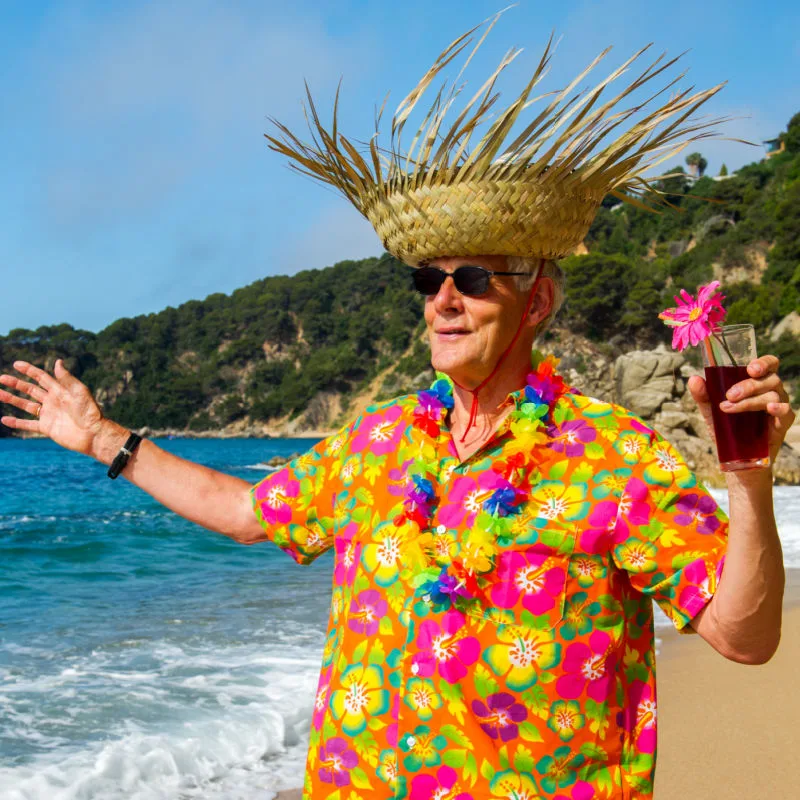 man in hawaiian shirt on the beach