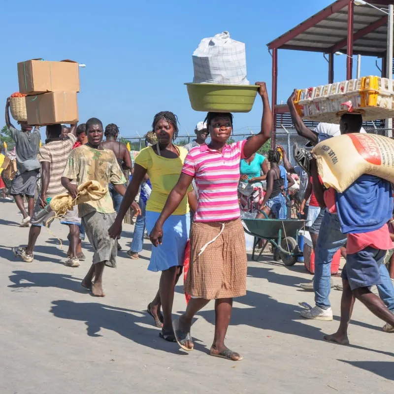 People carrying goods in Dajaban Haiti. 