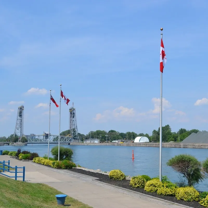 Port Colborne Ontario, Canada Canal water view with walkway and flags