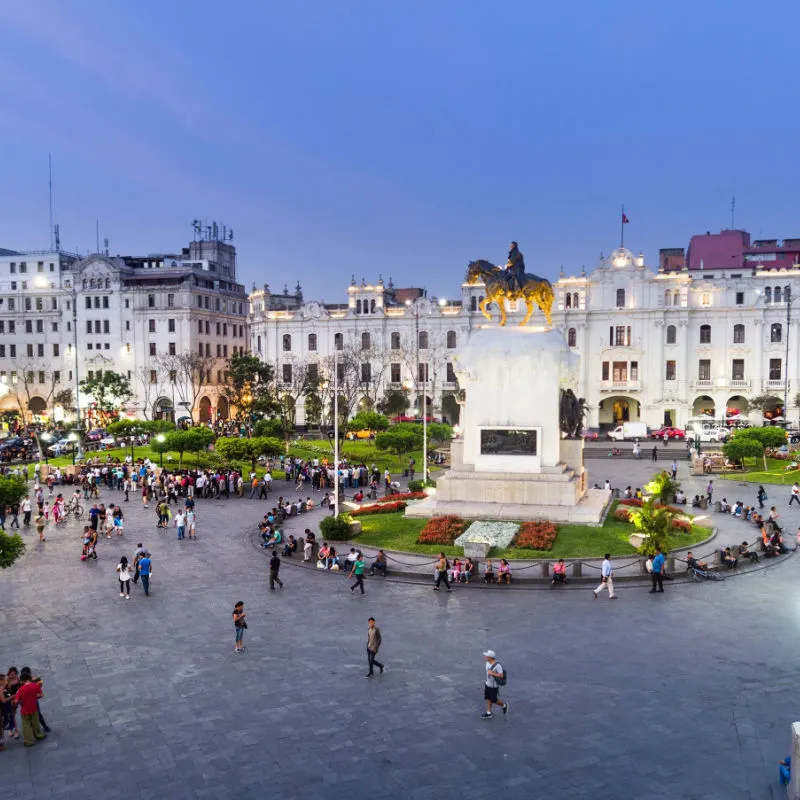 San Martin Plaza in Lima is a big open plaza with a statue in the center and historic buildings on the surrounding streets