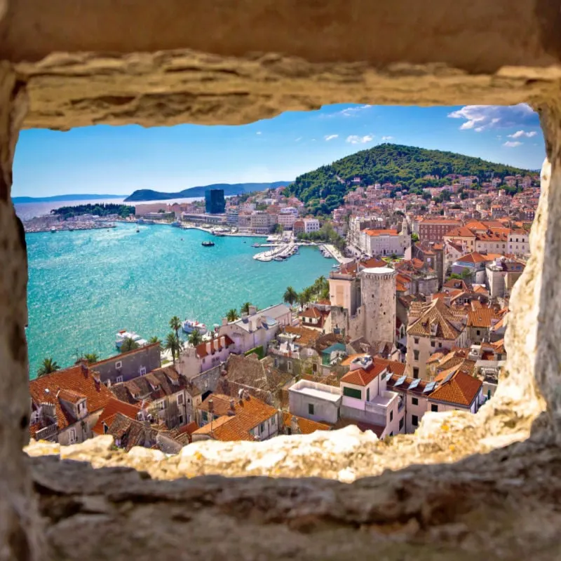 Split bay aerial view through stone window, Dalmatia, Croatia