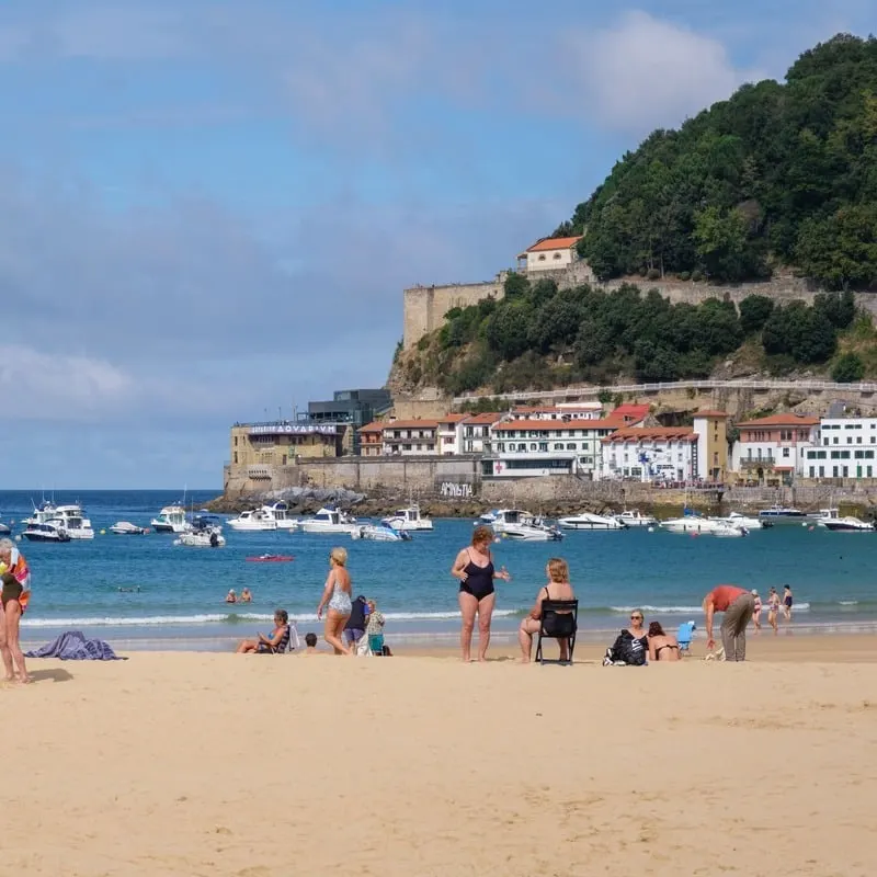 Tourists Bathing By The Beach In Donostia, San Sebastian, Basque Country, Northern Spain