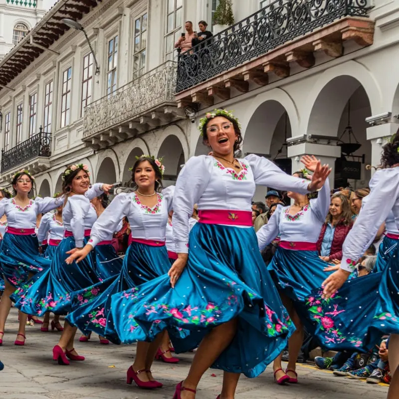 traditional dancers on the streets of cuenca ecuador
