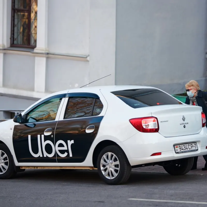 uber car picking up passenger