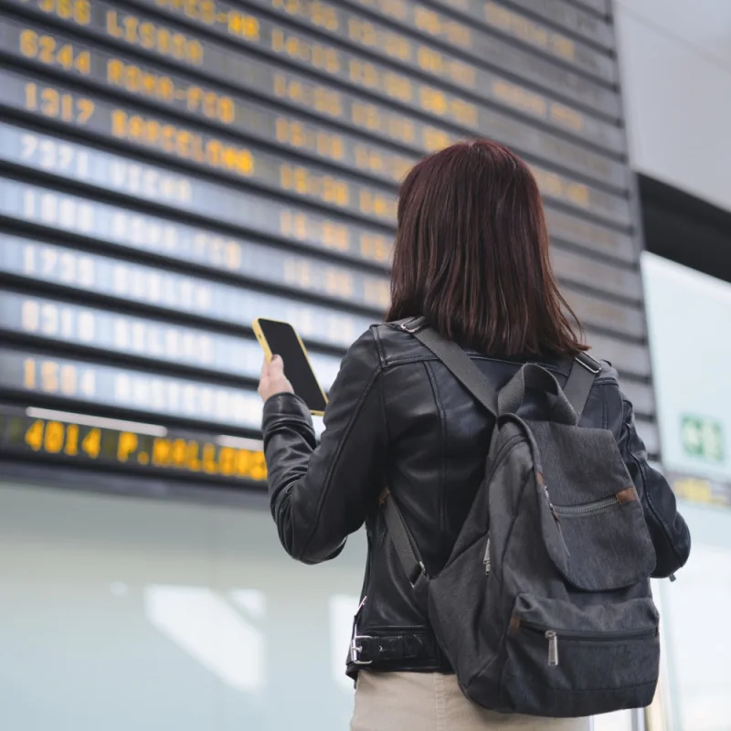 Woman Looking at Flight Cancelations