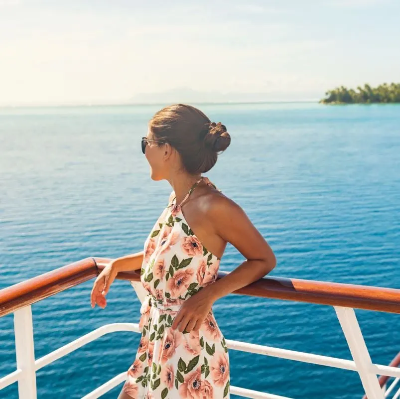 Woman looking out over cruise ship