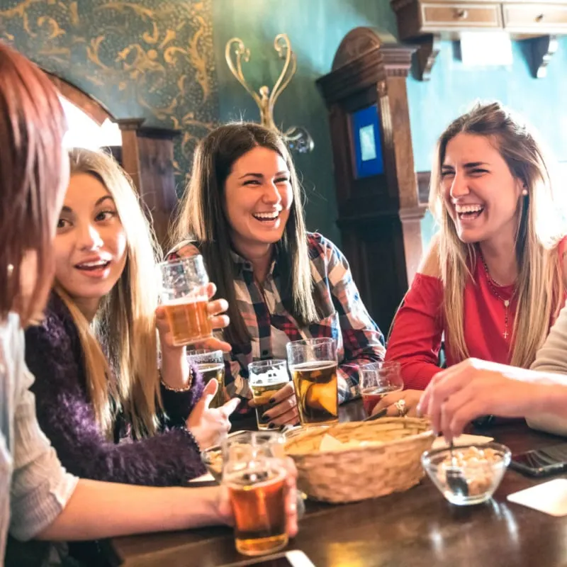 Women enjoying beers in an Irish pub