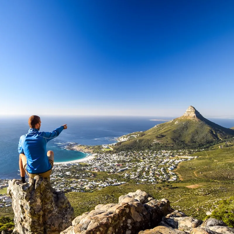 A man looking out from the view point at Table Mountain in Cape Town, South Africa